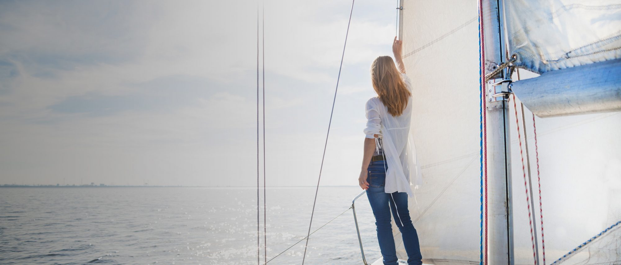 A female standing on a boat, call a top rated Oak Brook family law lawyer for help with your child support case.