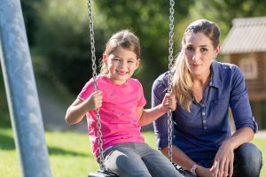 Little girl on swing with mother when custody issue speak to Parenting Time Attorney Elmhurst.
